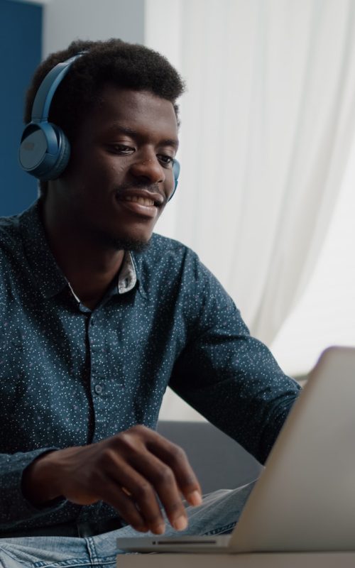 african-american-man-with-headphone-on-watching-movie-on-streaming-services.jpg